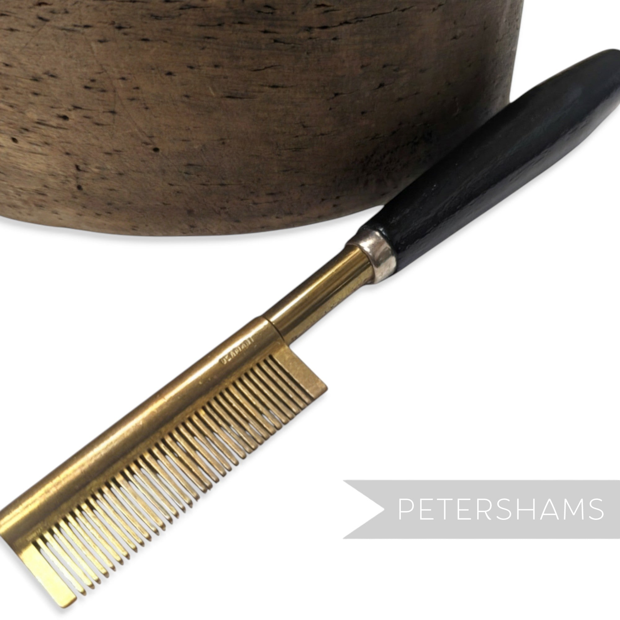 Petershams Millinery Supplies vintage 1940s brass hair straightener comb with black wooden handle, made in Germany.