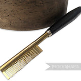 Petershams Millinery Supplies vintage 1940s brass hair straightener comb with black wooden handle, made in Germany.