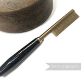 Petershams Millinery Supplies vintage 1940s brass hair straightener comb with black wooden handle, made in Germany.