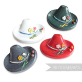 Petershams Millinery Supplies vintage hat buttons in red, white, green, and grey, featuring floral and cherry relief detail.