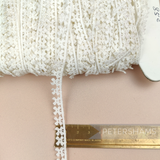 Petershams Millinery Supplies vintage 10mm ivory cotton guipure lace trim with a delicate windmill pattern.