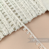 Petershams Millinery Supplies vintage 10mm ivory guipure lace trim with a prized doughnut pattern design.