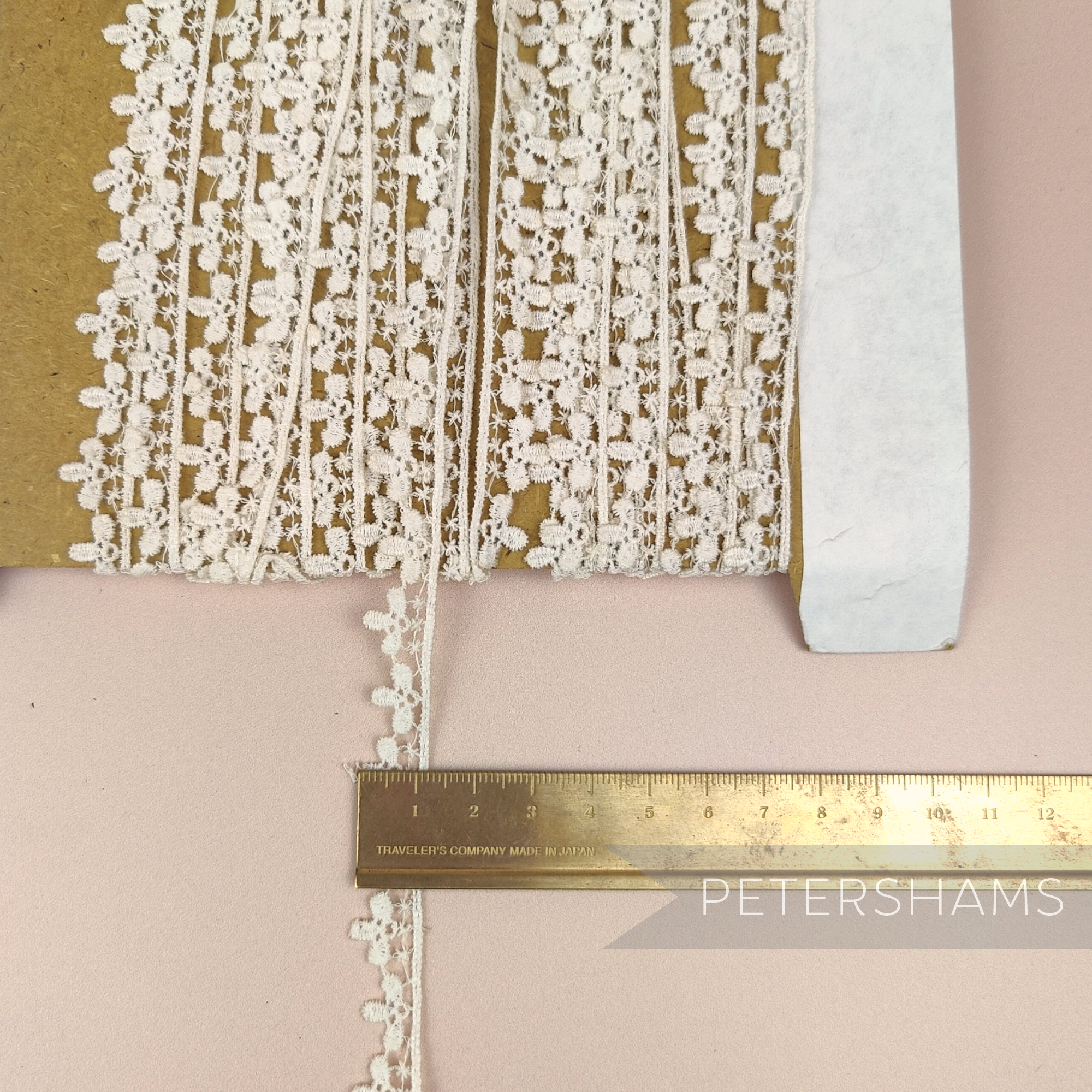 Petershams Millinery Supplies vintage 1950s ivory cotton guipure lace trim with star and fleur design on a card