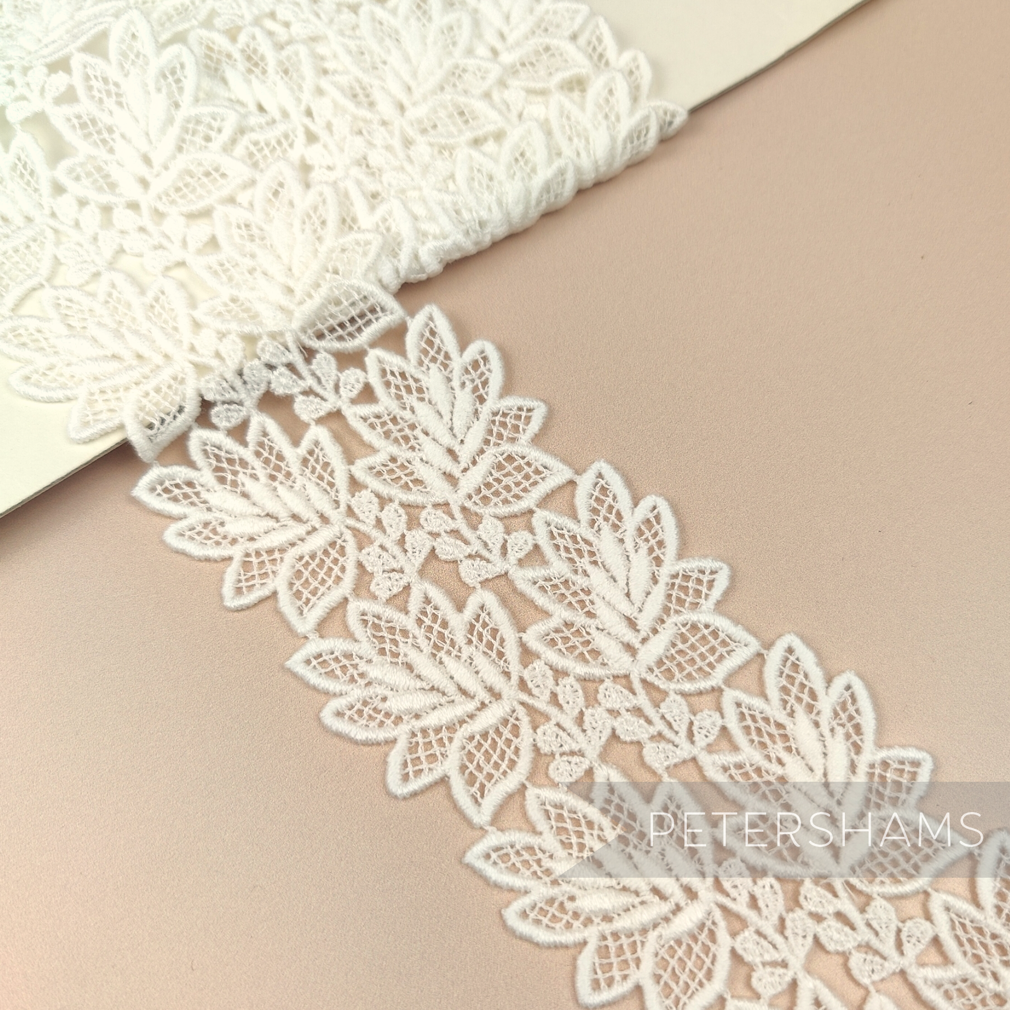 Petershams Millinery Supplies 6cm off-white vintage 1960s guipure lace trim with a delicate fine leaf design.
