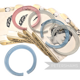 Petershams Millinery Supplies vintage metal toothed bun combs in assorted pastel colours with original backing cards