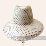 Petershams Millinery Supplies vintage Ecuador toquilla straw capeline with a spiral dash pattern and partially blocked crown.