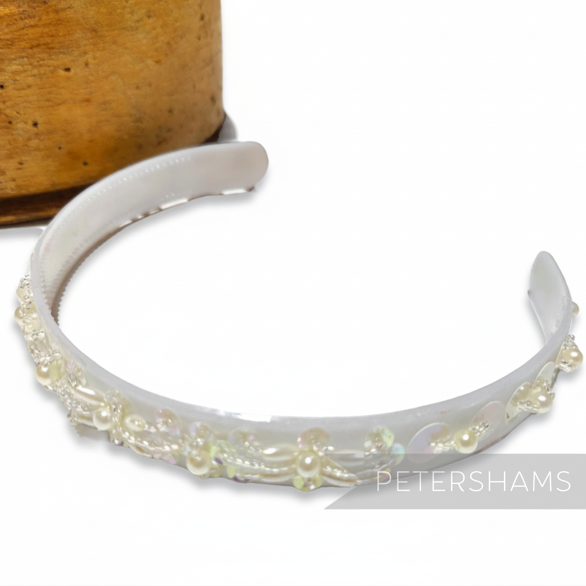 Petershams Millinery Supplies vintage 1990s white plastic headband adorned with iridescent sequins, pearls, and beads.