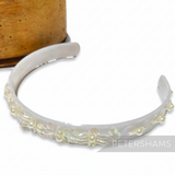 Petershams Millinery Supplies vintage 1990s white plastic headband adorned with iridescent sequins, pearls, and beads.