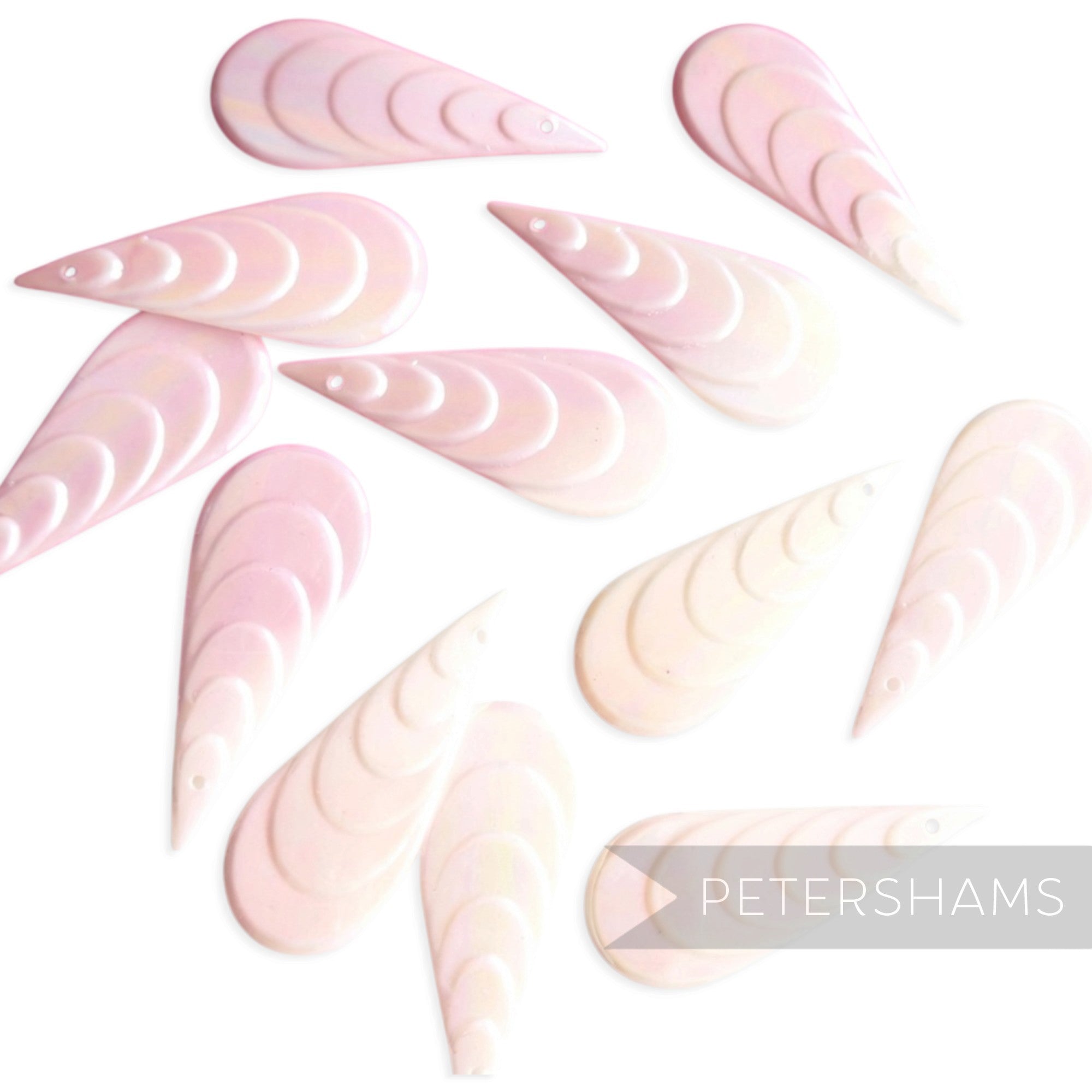 Petershams Millinery Supplies vintage 1940s teardrop sequins in light pink iridescent with a tiered relief design.