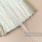 Petershams Millinery Supplies vintage 1960s 10mm off-white synthetic trim with tiny scalloped fuzzy pom poms