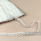 Petershams Millinery Supplies vintage 1960s off-white synthetic trim with tiny scalloped fuzzy pom poms
