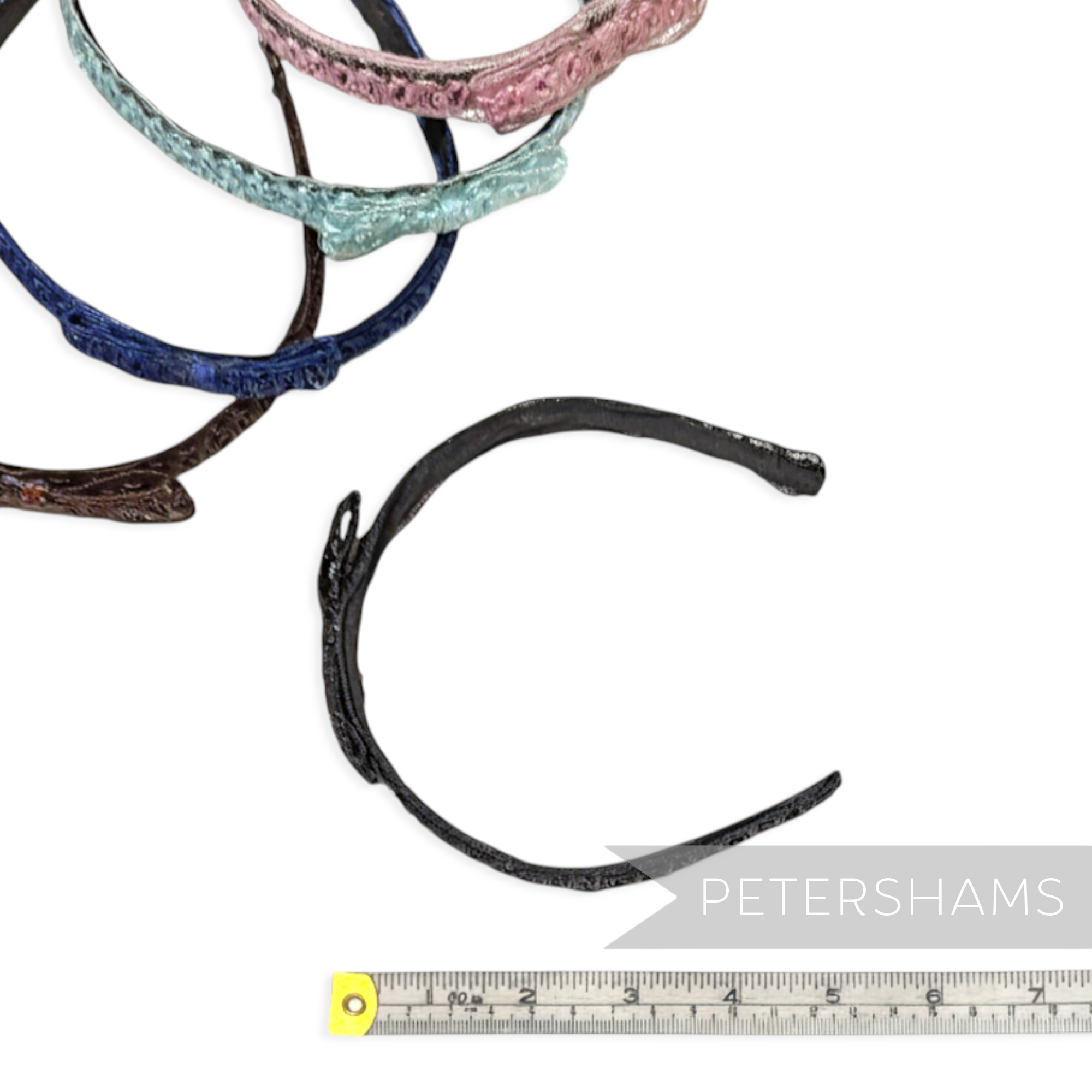 Petershams Millinery Supplies vintage 1960s black laminated raffia and crin braid headband with a bow detail.