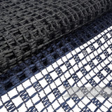 Petershams Millinery Supplies vintage Swiss laminated raffia mesh fabric in a black and navy checkerboard pattern.
