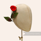 Petershams Millinery Supplies vintage 1960s red silk rosebud with wired leaves on a mannequin head