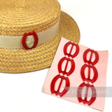 Petershams Millinery Supplies vintage red plastic tulip hat buckle shown on a straw hat and on a display card.