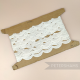 Petershams Millinery Supplies vintage off-white triple scallop Austrian lace trim on a cardboard spool