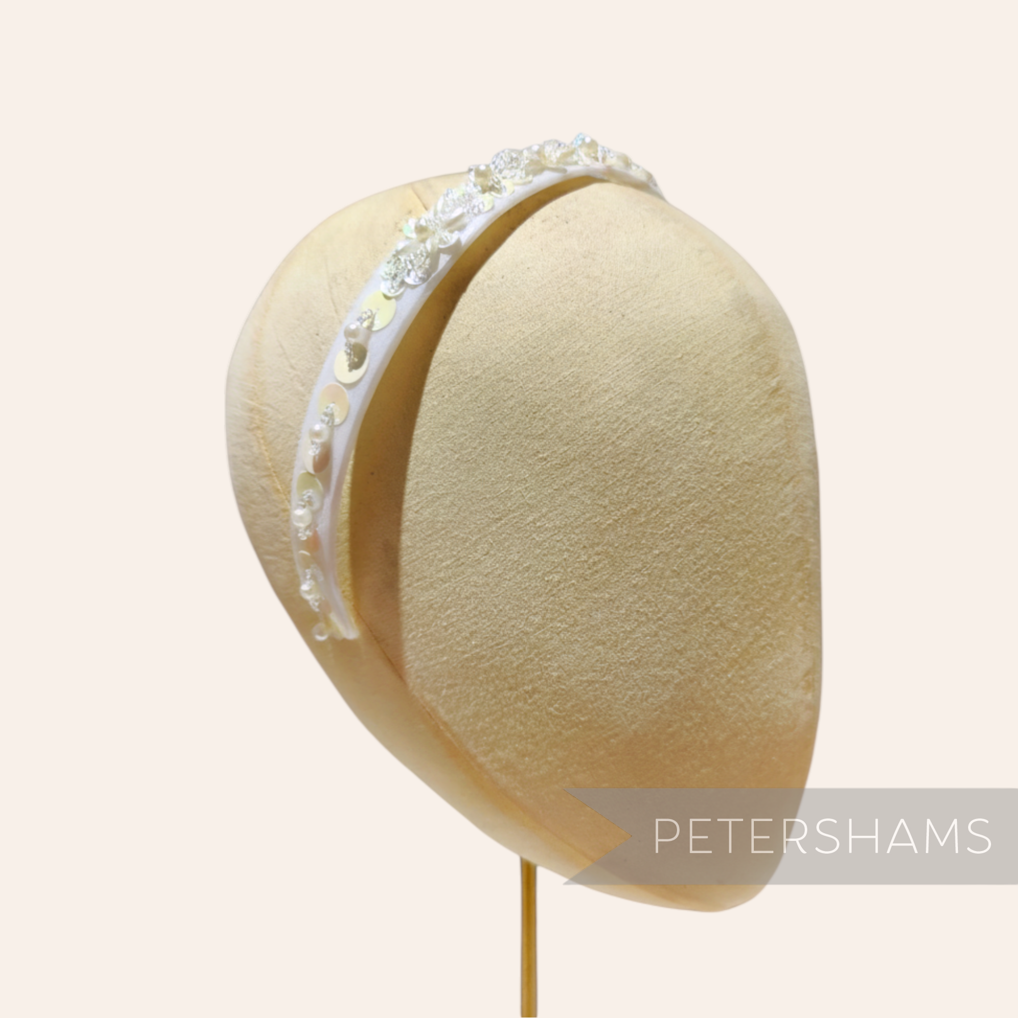 Petershams Millinery Supplies white plastic headband adorned with iridescent sequins, pearls, and beads. Vintage 1990s.