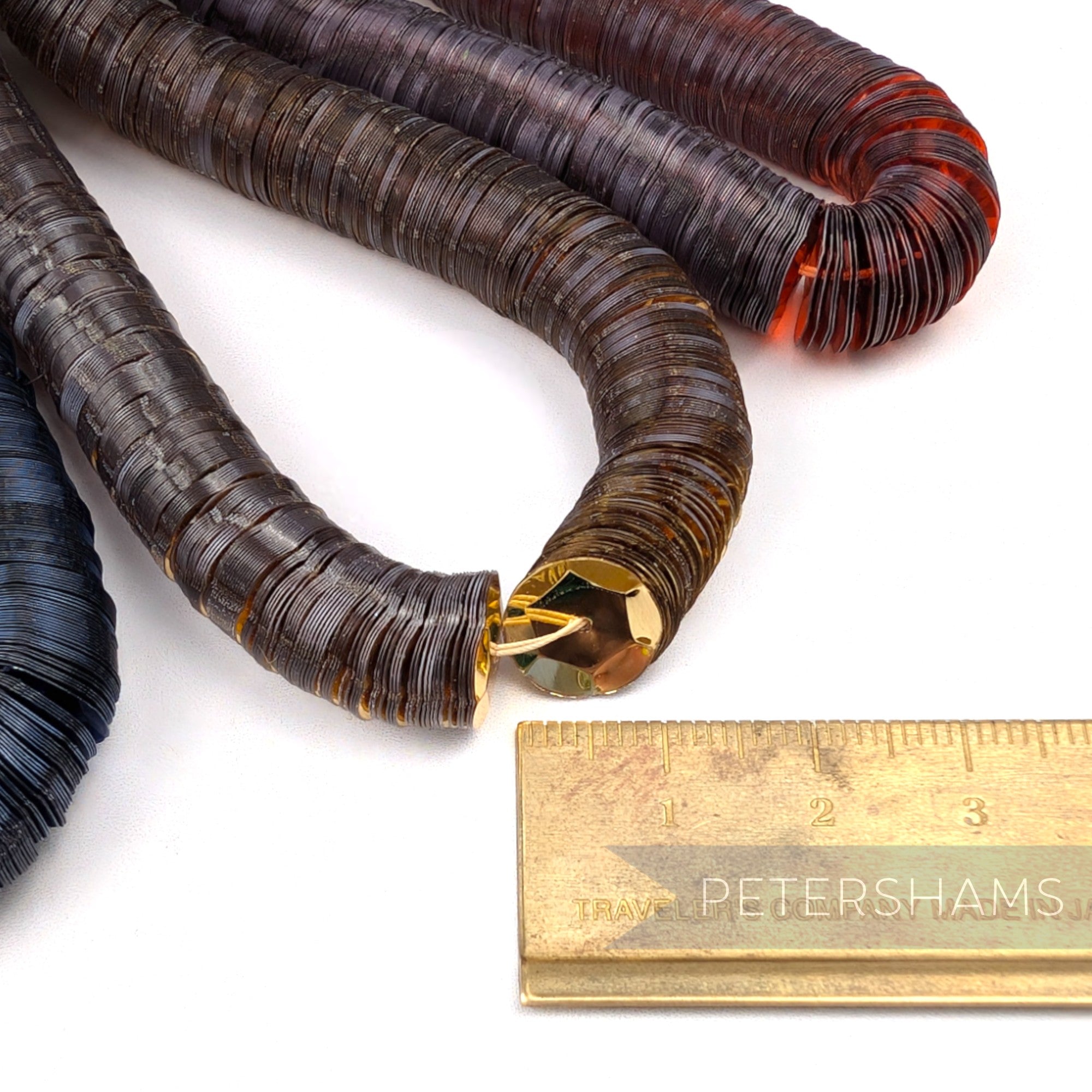 Petershams Millinery Supplies vintage 10mm cupped brown French sequins on embroidery worm strings with a metal ruler
