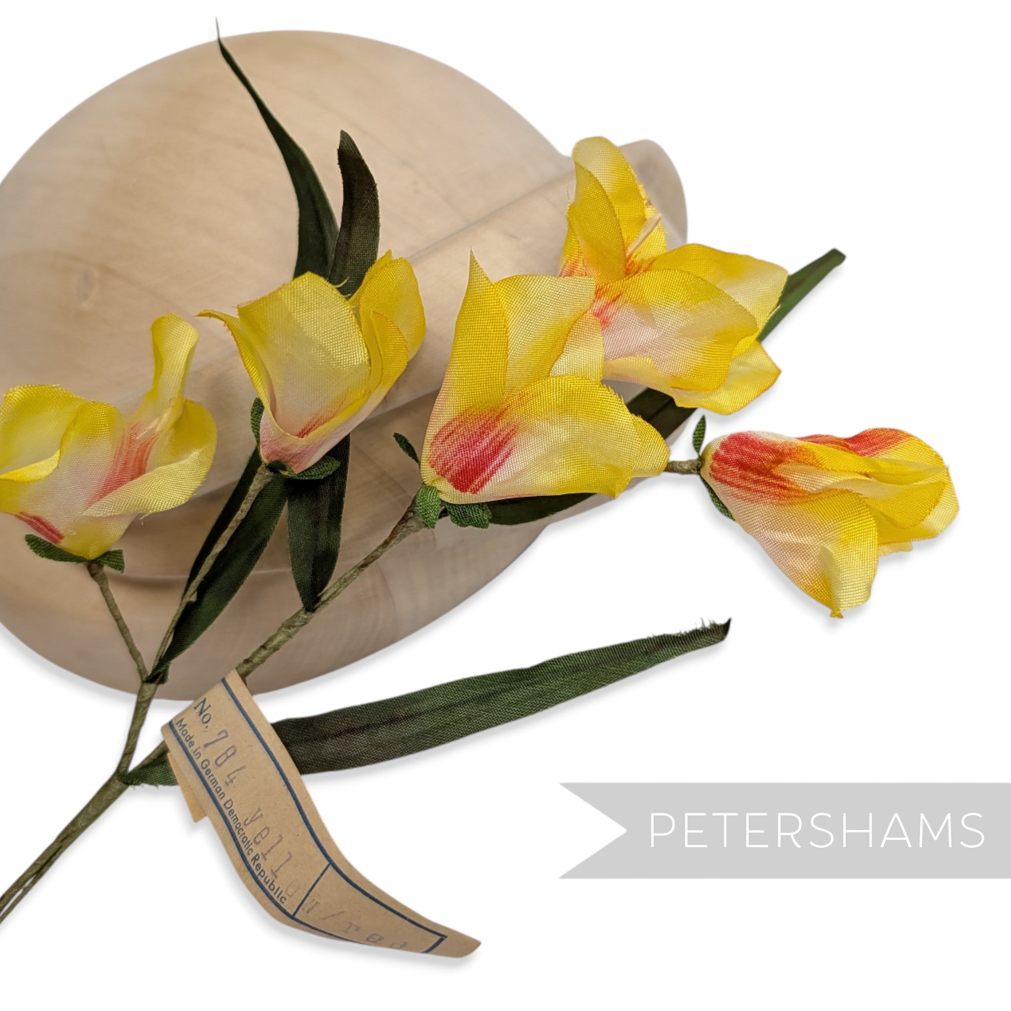 Petershams Millinery Supplies vintage 1960s German silk freesia flower mount with yellow blossoms and green leaves.