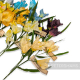 Petershams Millinery Supplies vintage 1960s German silk freesia flower mounts in yellow, blue, and purple shades.