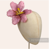 Petershams Millinery Supplies vintage 1950s pink silk hibiscus flower on a millinery display head