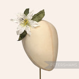 Petershams Millinery Supplies vintage silk lily flower hat mount with hand-painted spots and green paper mesh leaves.