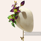 Petershams Millinery Supplies vintage 1950s German silk lily flower millinery mount in purple on a display head