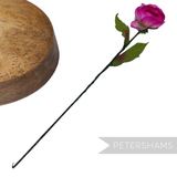 Petershams Millinery Supplies vintage 1960s silk rosebud flower with wired stem and leaves on a wooden millinery block.