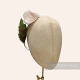 Petershams Millinery Supplies vintage 1960s silk rosebud flower with green wired leaves on a millinery head form