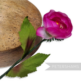 Petershams Millinery Supplies vintage 1960s silk rosebud in vibrant pink with green wired leaves and stem.