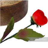 Petershams Millinery Supplies vintage 1960s red silk rosebud with wired green leaves and stem on a wooden block