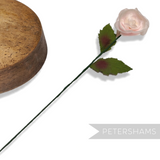 Petershams Millinery Supplies vintage 1960s silk rosebud in pale pink with two wired green leaves on a long stem
