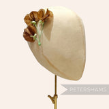 Petershams Millinery Supplies vintage 1950s German silk sweet pea flower stem in brown on a millinery head form.