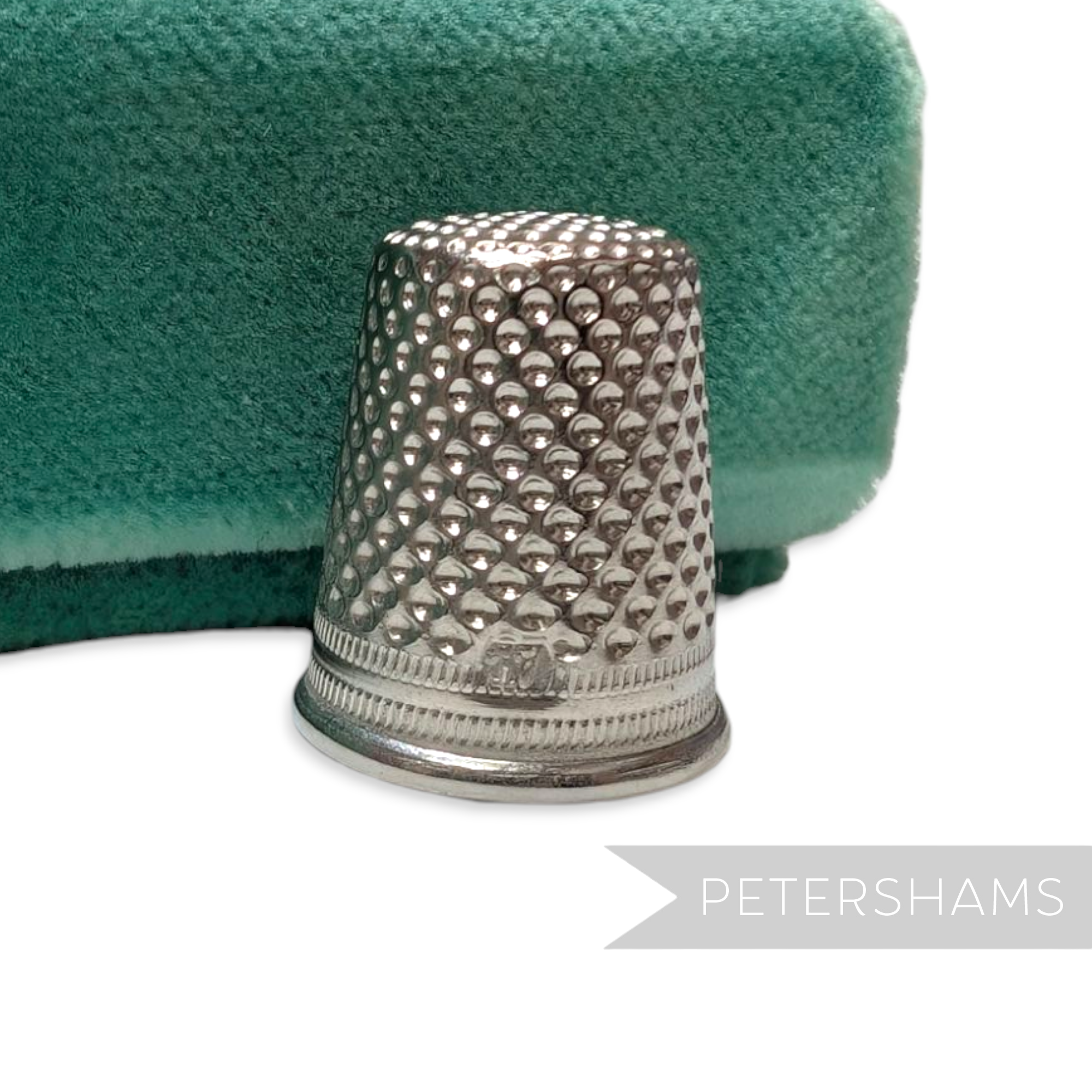 Petershams Millinery Supplies vintage German steel sewing thimble with a dimpled surface for millinery work.