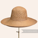 Petershams Millinery Supplies vintage Ecuador toquilla straw capeline hat with a knitted crown and ruffle detail.