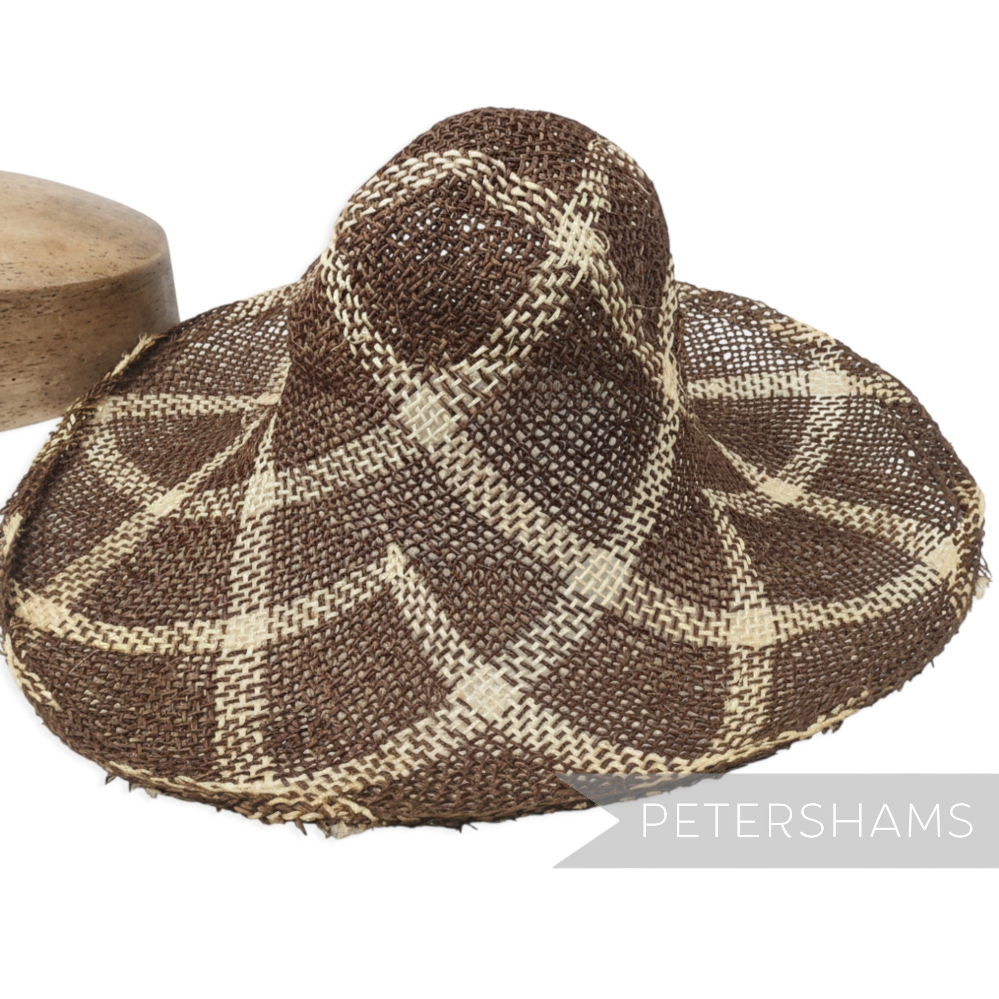 Petershams Millinery Supplies vintage 1990s seagrass and jute straw capeline with a brown roulette curve pattern.