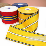 Petershams Millinery Supplies vintage 90mm wide moire striped grosgrain ribbon in yellow, red, and blue rolls.