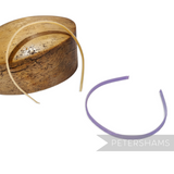 Petershams Millinery Supplies vintage 1960s skinny headband in pale yellow and lilac with swirl pattern and glossy finish.