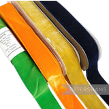 Petershams Millinery Supplies 38mm vintage velvet ribbons in emerald green, orange, golden yellow, and navy blue.
