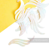 Petershams Millinery Supplies vintage French triple wing sequins with iridescent finish on a yellow background
