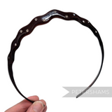 Petershams Millinery Supplies dark brown plastic headband with a wavy design and scattered clear diamantes.