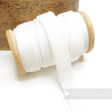 Petershams Millinery Supplies 16mm white elastic stretch velvet ribbon on a wooden spool for millinery projects