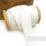 Petershams Millinery Supplies 23mm white elastic stretch velvet ribbon on a wooden spool for millinery projects