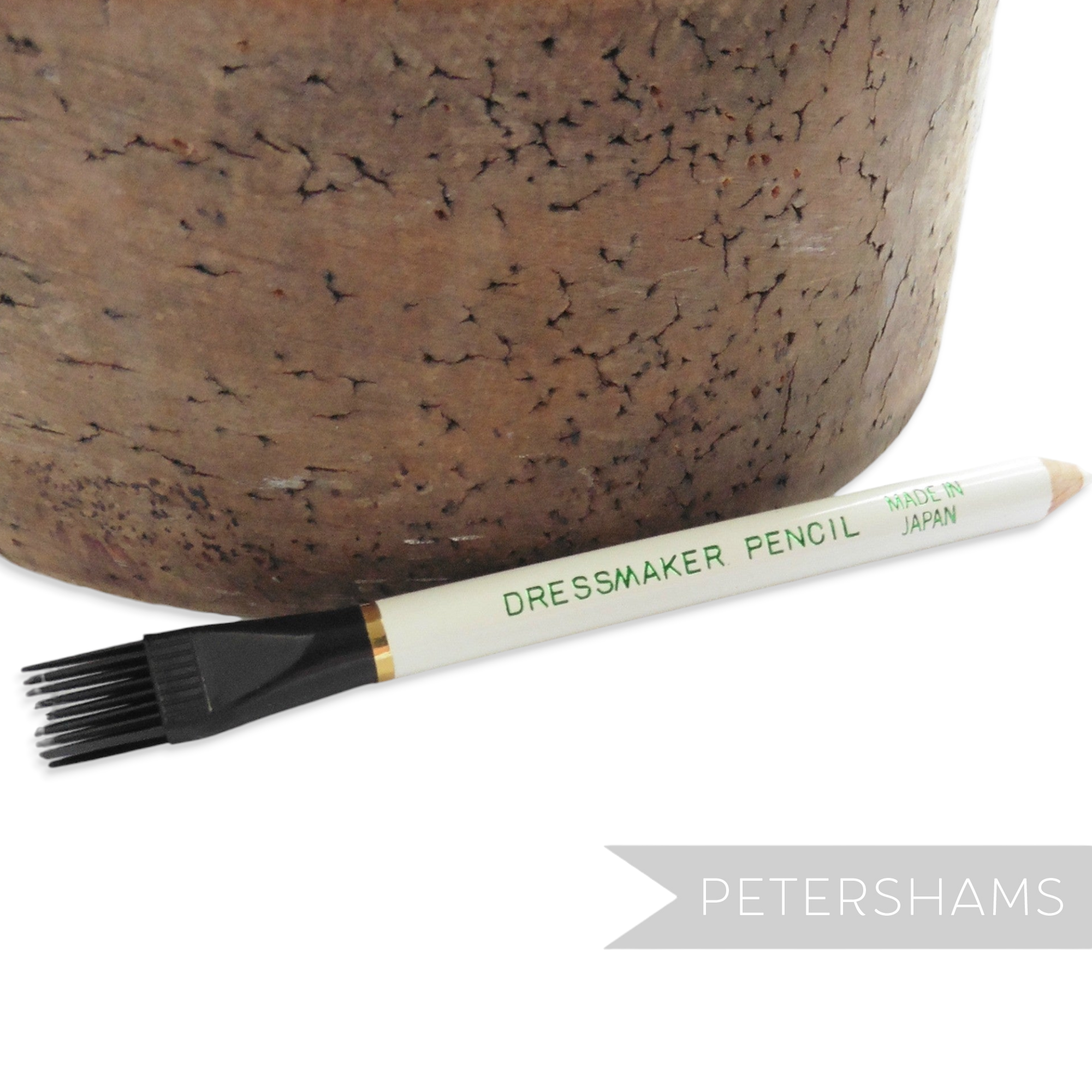 Petershams Millinery Supplies white dressmaker fabric marking pencil with a black brush tip for sewing projects