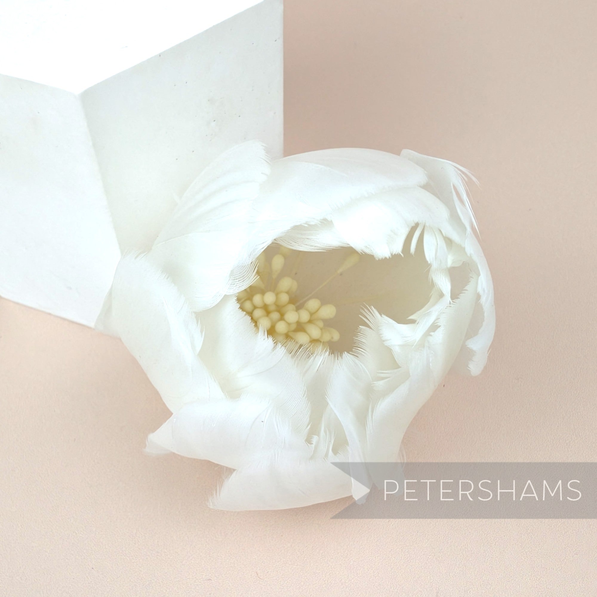 Petershams Millinery Supplies large white tulip feather flower made from cupped goose nagorie feathers with stamens.