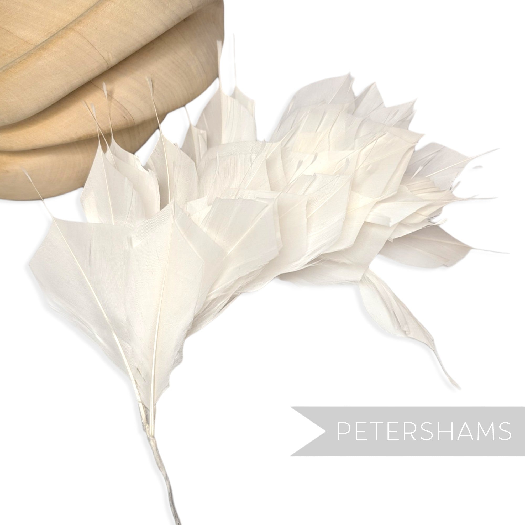 Petershams Millinery Supplies large ivory spiky goose feather wired hat mount for millinery and headpiece design.