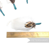 Petershams Millinery Supplies small white feather hat mount with pheasant and goose feathers on a jade tape base
