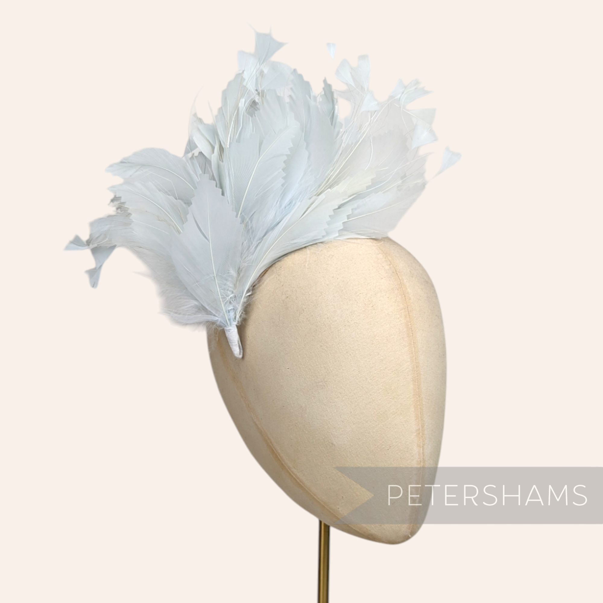 Petershams Millinery Supplies large pale grey feather hat mount featuring zig zag goose and coque feathers