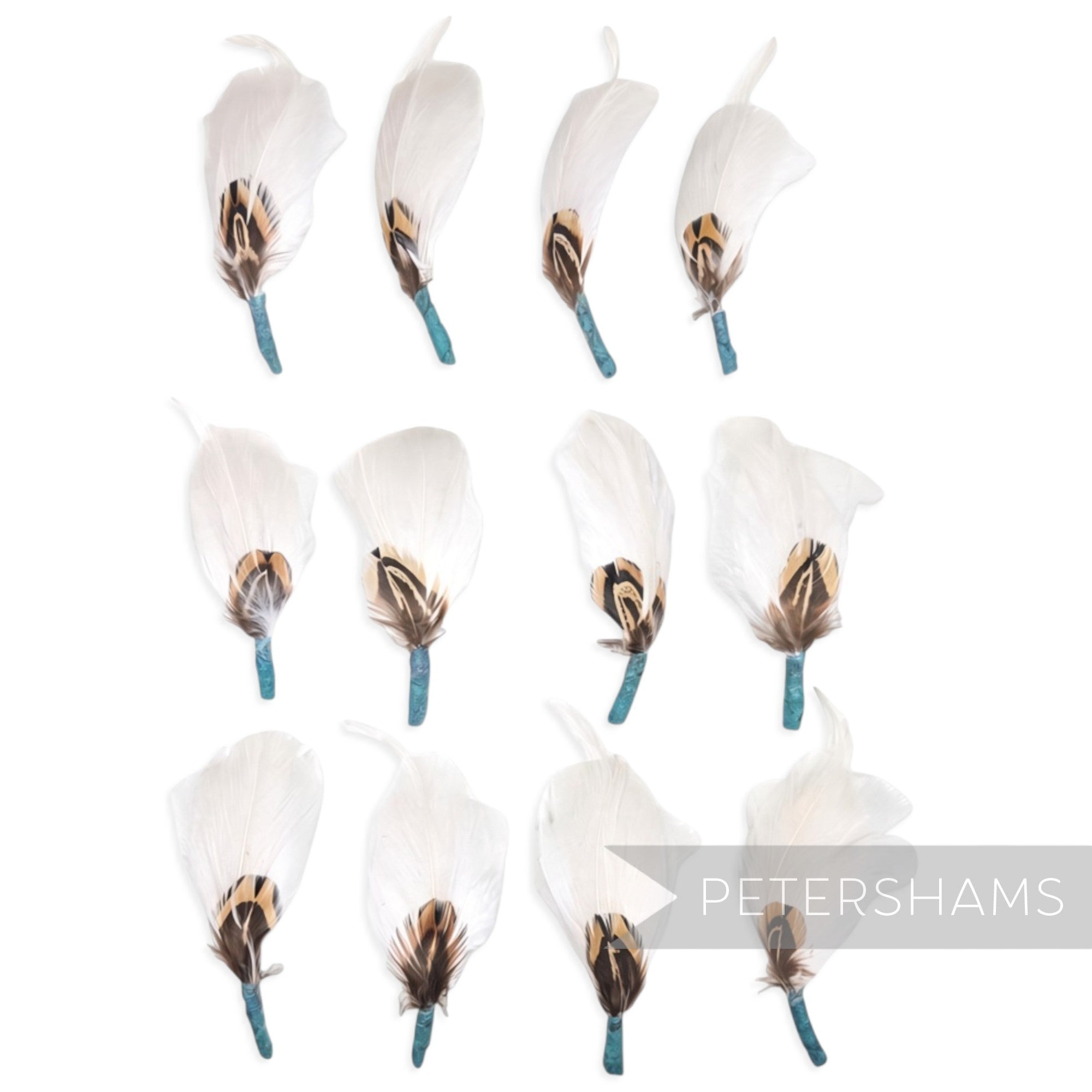 Petershams Millinery Supplies white feather hat mounts with pheasant, hackle, and goose feathers and jade tape base.