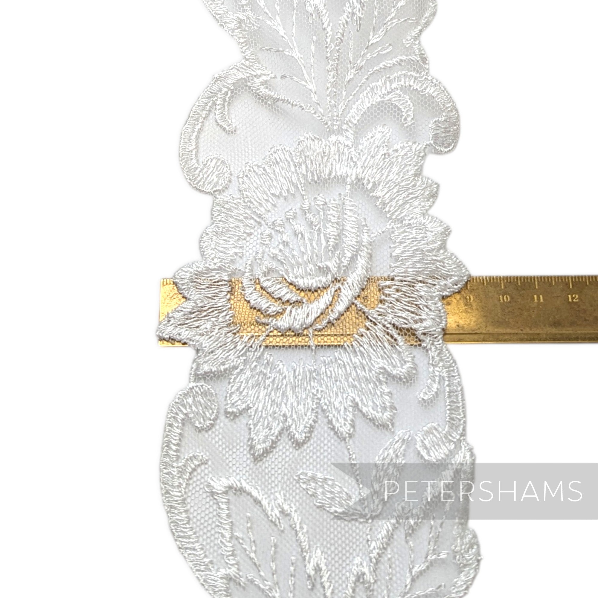 Petershams Millinery Supplies white sheer lace trim with embroidered flower pattern and swirly border, 9cm wide.